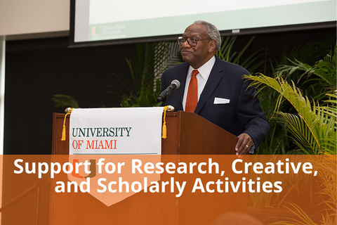 Click here to view Support for Research, Creative, and Scholarly Activities details - photo is Professor Spivey at a lecture - photo taken by Jeny Abreu